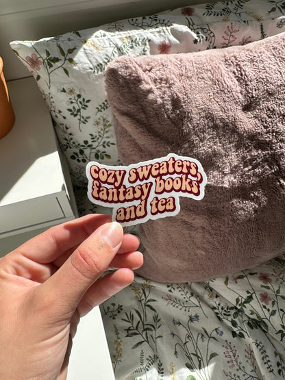 Cozy sweaters, fantasy books and tea sticker
