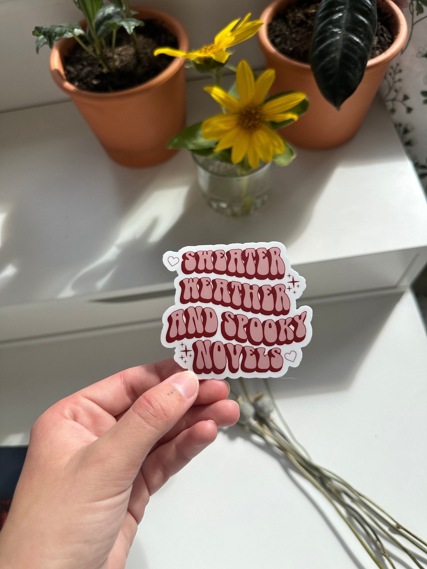 Sweater Weather and Spooky Novels Sticker