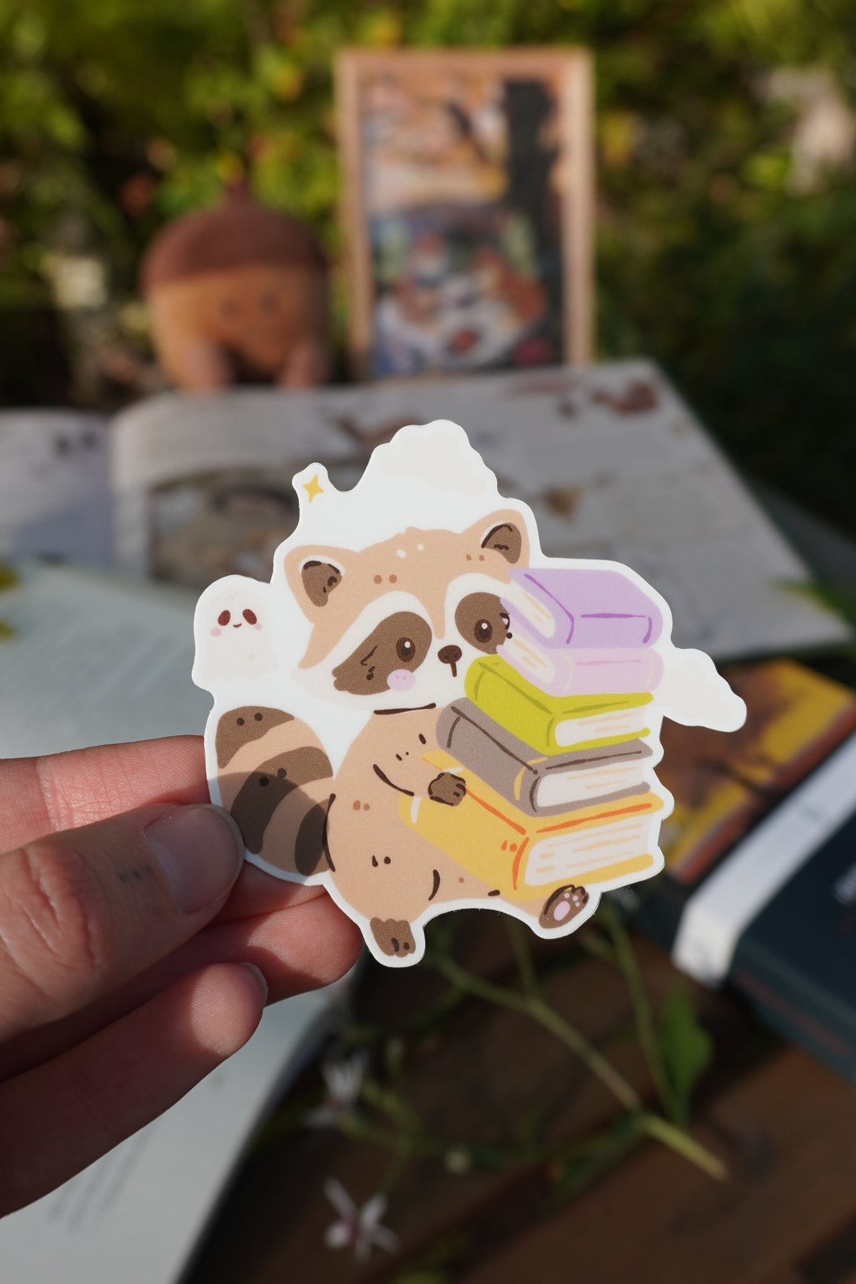 Raccoon Carrying Books Sticker