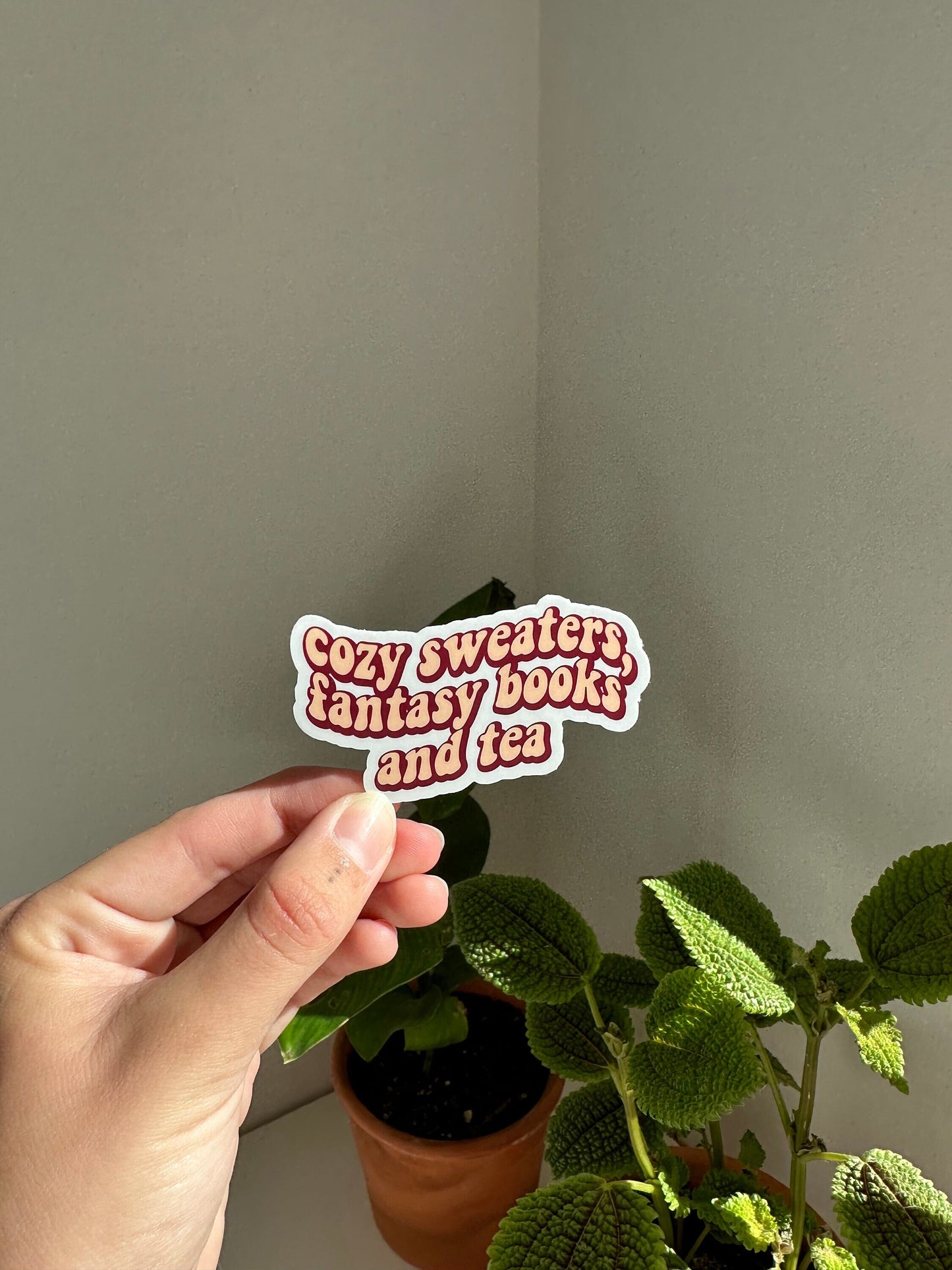 Cozy sweaters, fantasy books and tea sticker