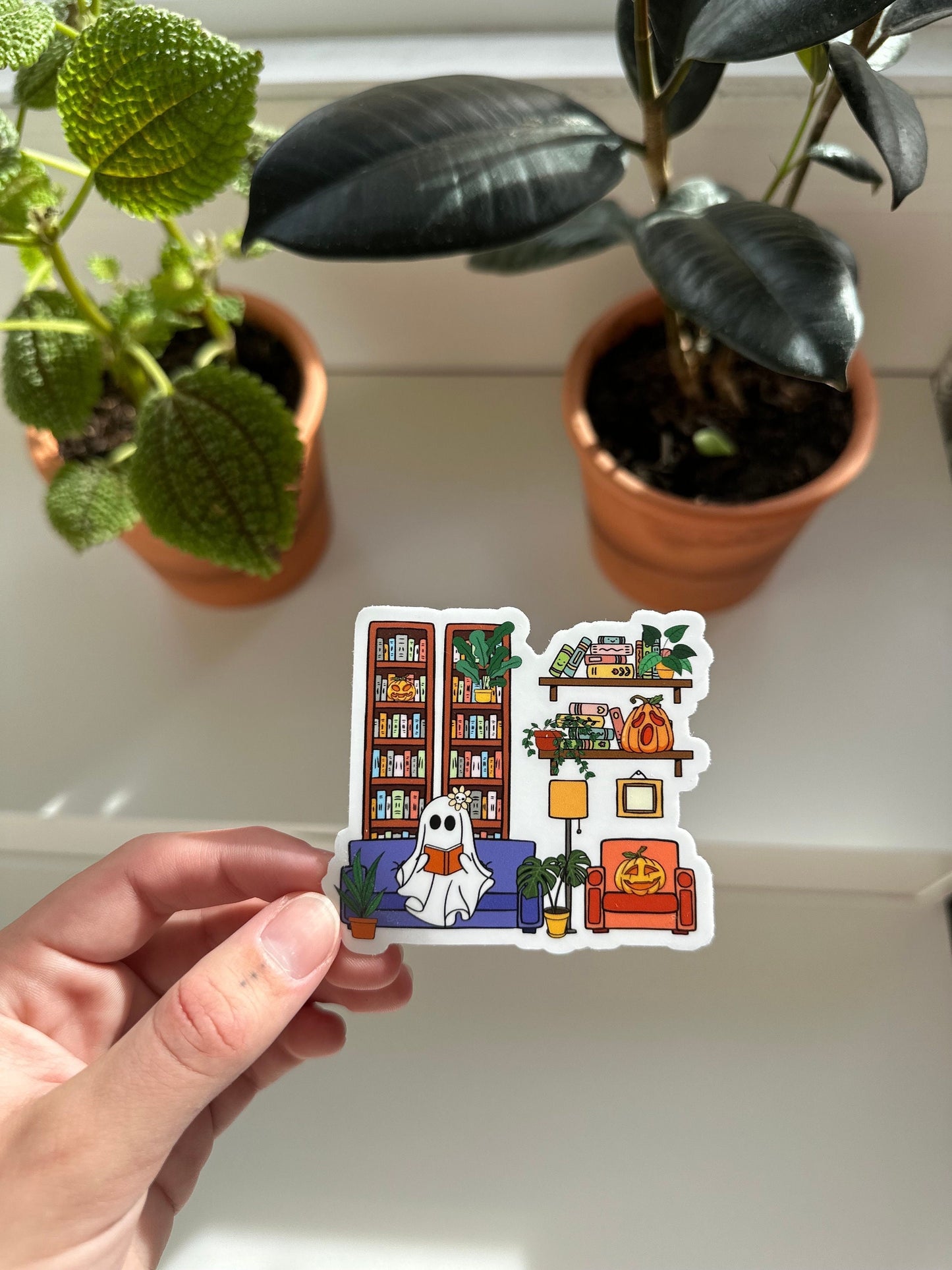 Cute Ghostie Reading Sticker with a Bookshelf