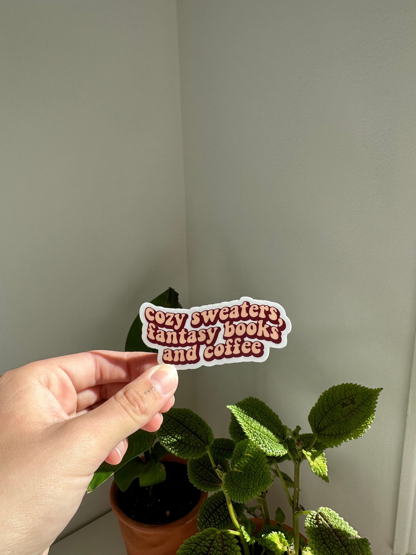 Cozy sweaters, fantasy books and coffee sticker