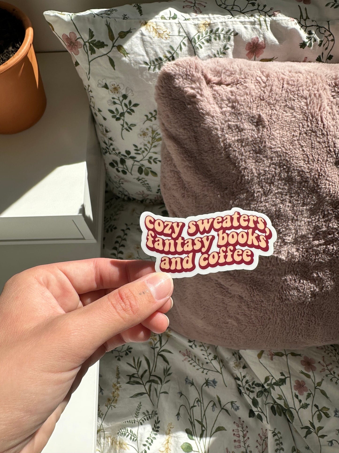 Cozy sweaters, fantasy books and coffee sticker